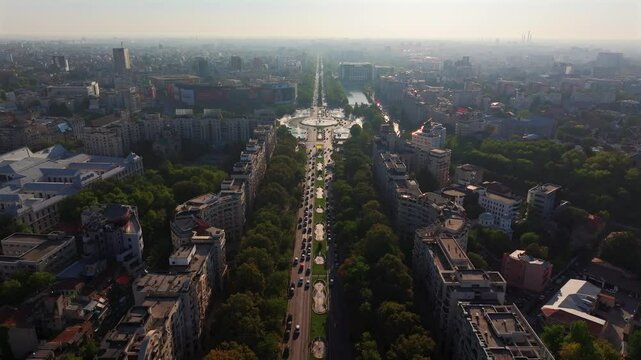 Bucharest Aerial 4k video with Unirii Square (Piata Unirii in Romanian) in the city center of Bucharest during a beautiful summer morning. Travel to Romania landmarks.