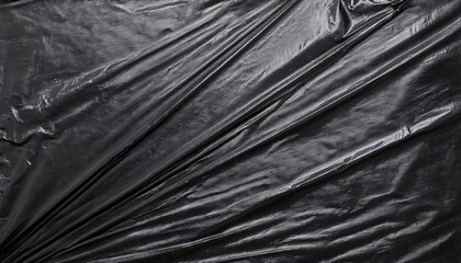 Fototapeta premium Creased black plastic polyethylene film texture