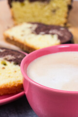 Coffee with milk and fresh baked yeast dough with cocoa for different festive occasions. Delicious dessert