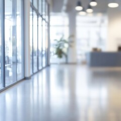 Fototapeta premium A blurred view of a contemporary office space featuring panoramic windows and soft natural light