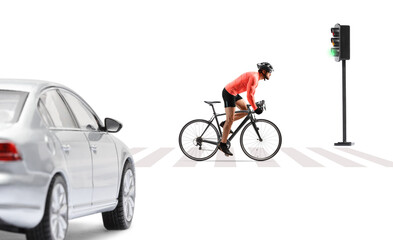 Naklejka premium Cyclist with helmet and sunglasses riding a bicycle on a street in front of a car