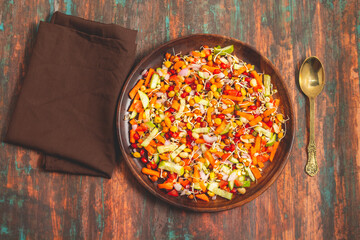 Vibrant Quinoa Salad with Fresh Vegetables, Tangy Citrus Dressing, Crunchy Nuts, Avocado, and a Zesty Herb Infusion.