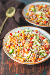 Vibrant Quinoa Salad with Fresh Vegetables, Tangy Citrus Dressing, Crunchy Nuts, Avocado, and a Zesty Herb Infusion.
