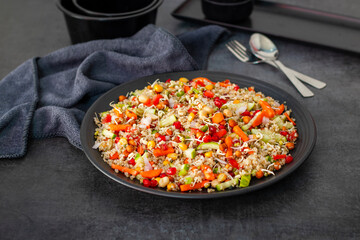Vibrant Quinoa Salad with Fresh Vegetables, Tangy Citrus Dressing, Crunchy Nuts, Avocado, and a Zesty Herb Infusion.