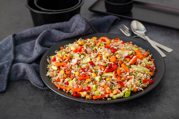 Vibrant Quinoa Salad with Fresh Vegetables, Tangy Citrus Dressing, Crunchy Nuts, Avocado, and a Zesty Herb Infusion.