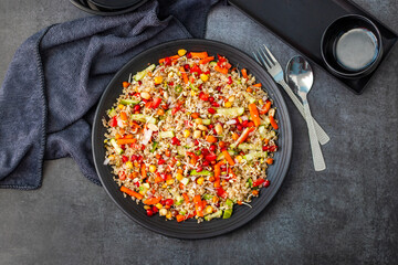 Vibrant Quinoa Salad with Fresh Vegetables, Tangy Citrus Dressing, Crunchy Nuts, Avocado, and a Zesty Herb Infusion.