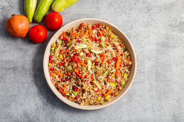 Vibrant Quinoa Salad with Fresh Vegetables, Tangy Citrus Dressing, Crunchy Nuts, Avocado, and a Zesty Herb Infusion.