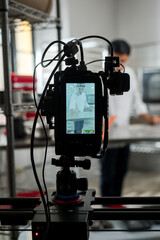 Pastry chef broadcasting live lesson for making apple desserts. Vertical plane