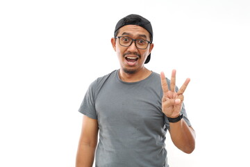 Asian man wearing casual shirt and glasses showing with fingers number three while smiling...