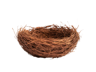 a brown bird nest on a white surface