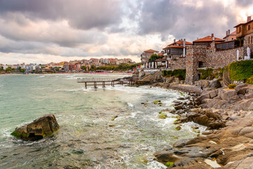 sozopol, bulgaria - 05 sep 2019: embankment of the ancient resort town by the sea at sunset. cloudy...