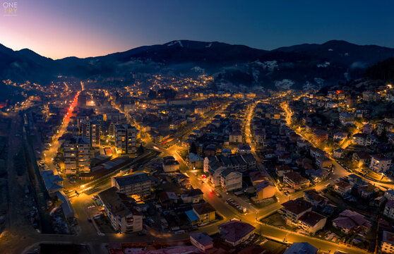 Night aerial photo of a city in the mountains