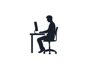 a silhouette of a man sitting at a desk using a computer