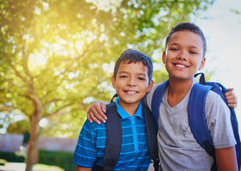 Portrait, hug and boys with education, friends and bonding together with knowledge, smile and joy. Face, outdoor and happy kids with embrace, backpack and scholarship with break, childhood and school