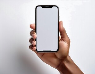 Close-up of a hand holds a smartphone with a blank screen against a white background.  (1)