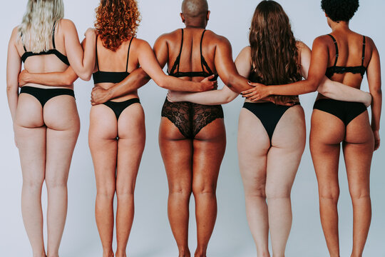 Beautiful diverse women wearing lingerie posing for body positive concepts - Multiethnic group of female adults celbrating body acceptance, diversity, self-esteem
