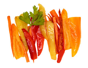 Fried or baked vegetables. Top view. Multi-colored chopped peppers, carrots, onions and parsley. Isolate on a transparent background.