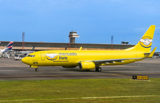 Mercado Livre company plane ready to take off. Yellow cargo plane. Bras&iacute;lia airport