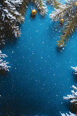 ark blue background for at christmas magazine cover with snow, spruce, bells, top view
