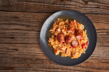 Cabbage stew with sausages and ham