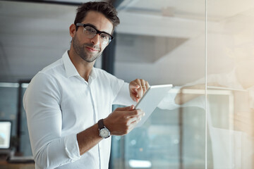 Man, portrait and tablet at window for business, connectivity and happy for career development. Journalist, technology and glasses in agency for article release, news research and space in Italy