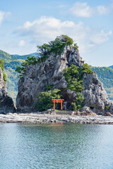 Isolated shinto shrine on Bentenjima island in Nachikatsuura, Japan. Scenic rocky landscape from...