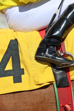 Horse racing jockey number four position