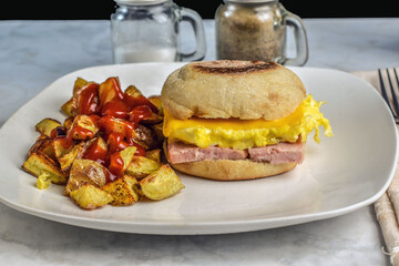 spam and scramble egg on a english muffin