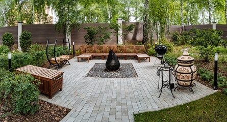 Enjoy a tranquil and peaceful outdoor living space that features a cozy fire pit along with a comfortable seating area designed for relaxation