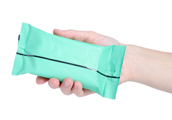 Fototapeta premium a pack of wet wipes in female hand on white background isolation