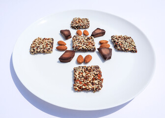 Delicious and crunchy Chocolate Almond bar. Home made chocolate bar with pieces of almond nuts 