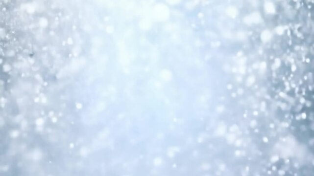 Snowflakes fall gracefully during a winter storm, creating a magical bokeh effect. The scene captures a serene and dreamlike atmosphere, perfect for evoking feelings of tranquility and wonder