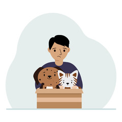 A little boy holds a cardboard box with a cat and a dog. The concept of rescue, help and care for pets.