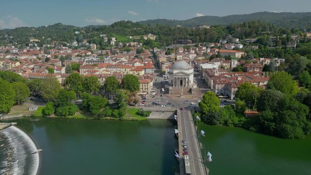 The drone aerial footage of Gran Madre di Dio church and Ponte Vittorio Emanuele I bridge that crosses the river Po. 