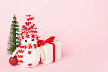 Small christmas trees with decoration on color background
