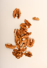 Peeled walnuts on a white background.
