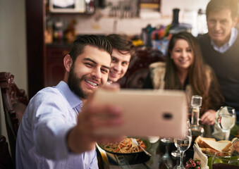 Happy family, smile and selfie by dinner table for photography, memory or social media together at home. Men, parents and bonding with reunion for picture, thanksgiving or holiday dining at house