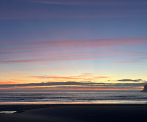 Beach Sunset with Rock Silhouette