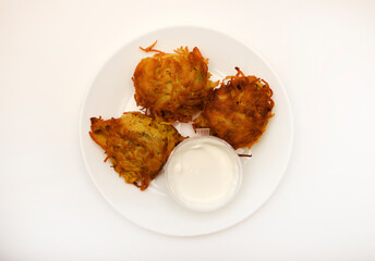 Fried potatoes in small pieces. Draniki. Delicious breakfast.
