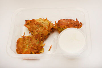 Fried potatoes in small pieces. Draniki. Delicious breakfast.