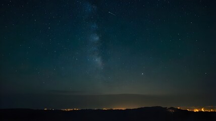 Fototapeta premium Night sky with glowing stars, showcasing the milky way galaxy, with the city lights shining in the background, wallpaper art