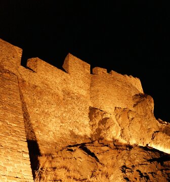 The illuminated walls of the stone, medieval, Myrina Castle, at night, Limnos, Greece