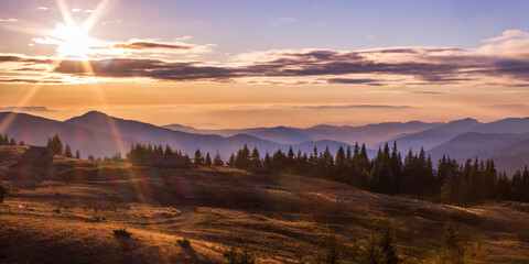 splendid autumn scenery in the mountains, foggy morning dawn, nature colorful background, Europe