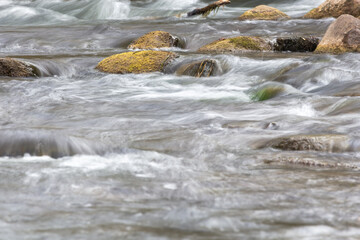 River rapids gently flowing over rocks