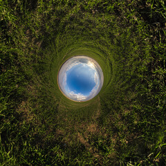 blue hole sphere or globe little planet inside sand or dry ground frame background with tractor...