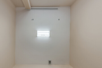 ceiling with vintage halogen spots lamps and drywall construction in empty room in house or office. Looking up view