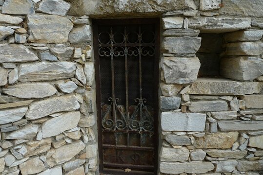An old stone building with an iron forged door, Filoti village,  Naxos island, Greece