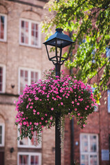 decorative flowers on a street lamp 