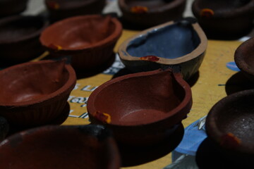 Artistic homemade clay oil lamps or karthikai deepam are ready for diwali and karthikai festivals