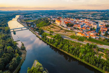 Melnik Castle on the hill above Labe and Vltava River in sunny day.  Church with city space and square. Czech Republic.